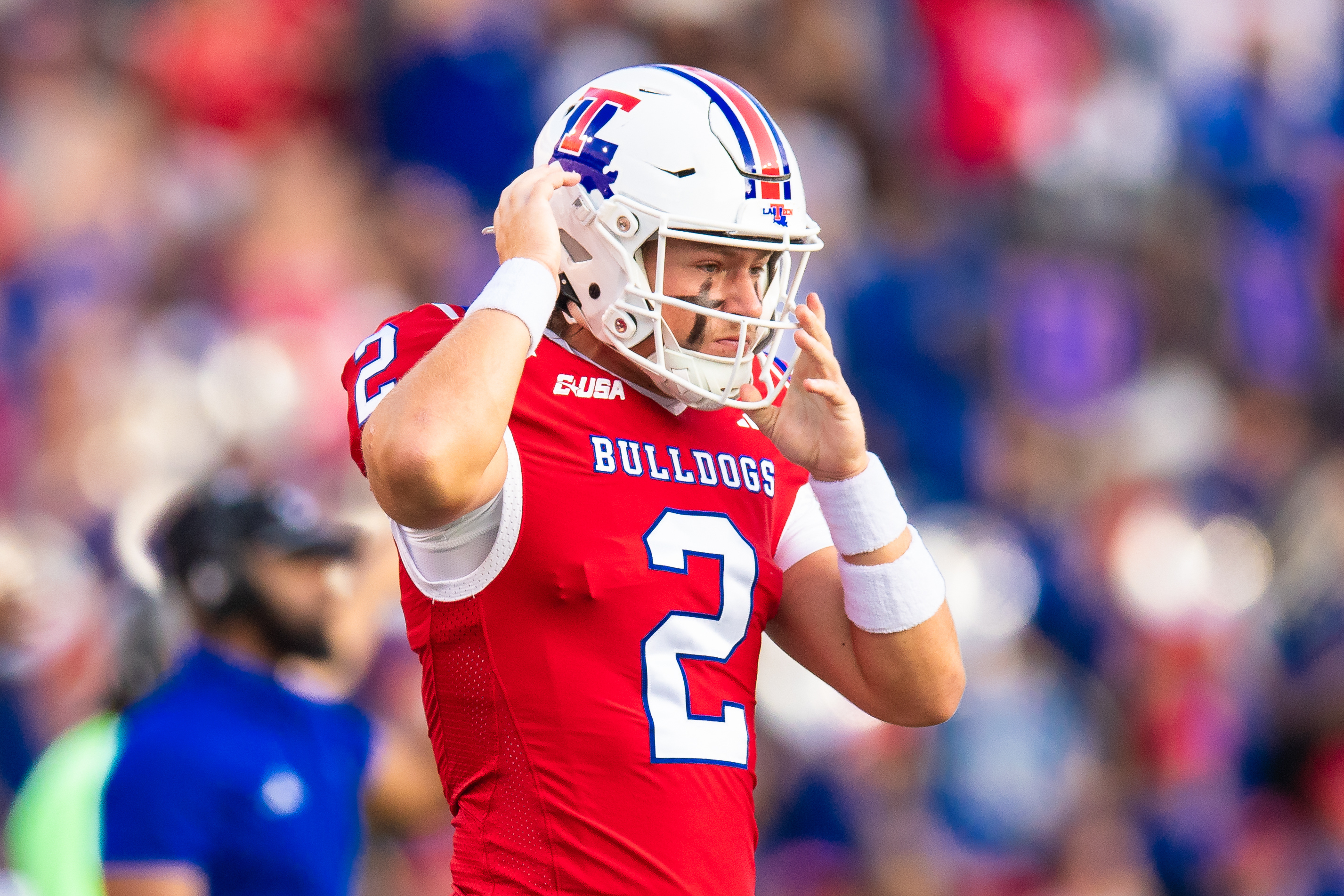 Louisiana Tech quarterback Trey Kukuk (2) straps up his helmet as we offer our Coastal Carolina vs. Louisiana Tech predictions today.