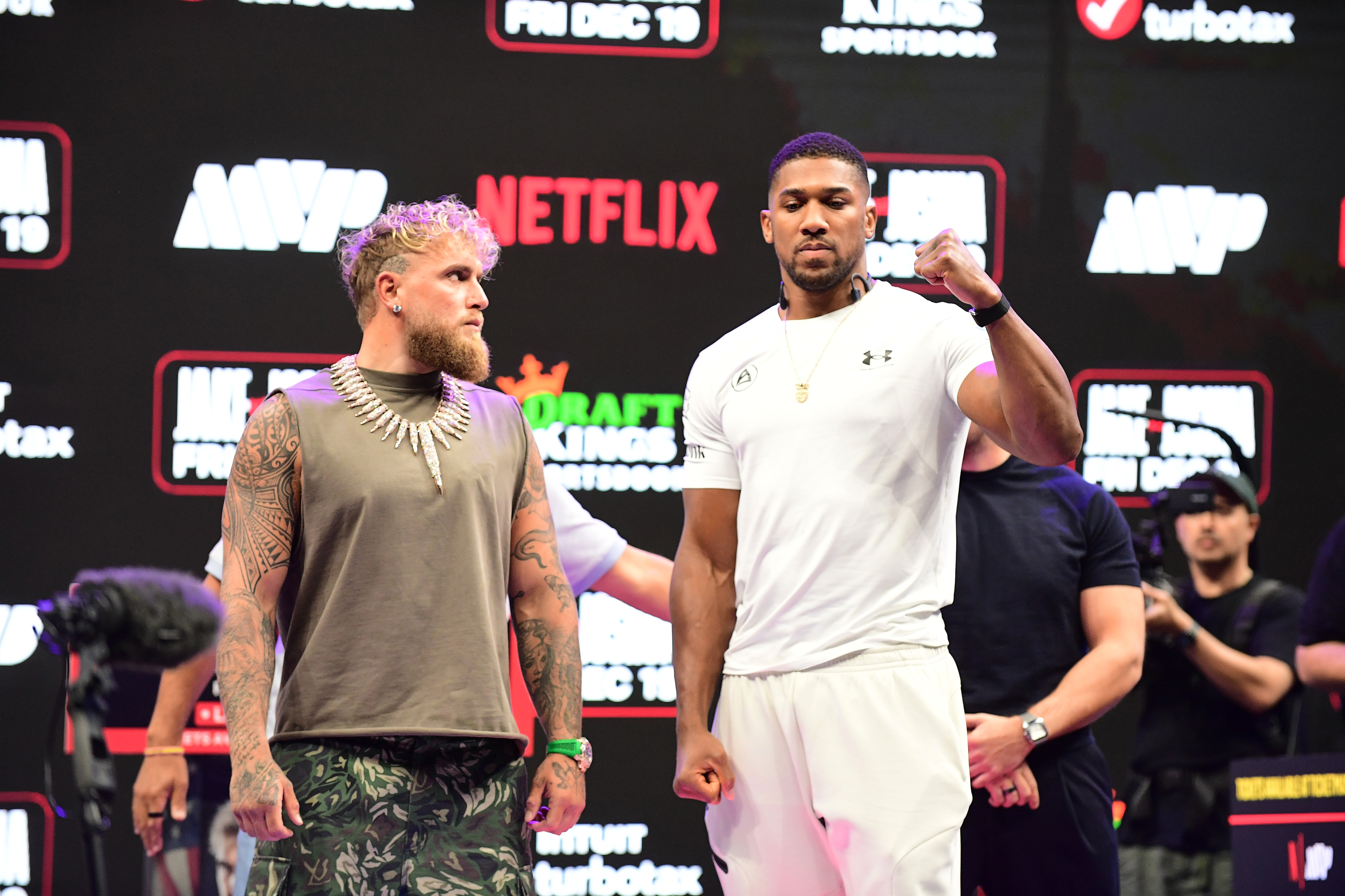 Jake Paul and Anthony Joshua pose for photos during the press conference for the upcoming Jake Paul vs Anthony Joshua boxing match on Netflix at the Kaseya Center in Miami, Fla.
