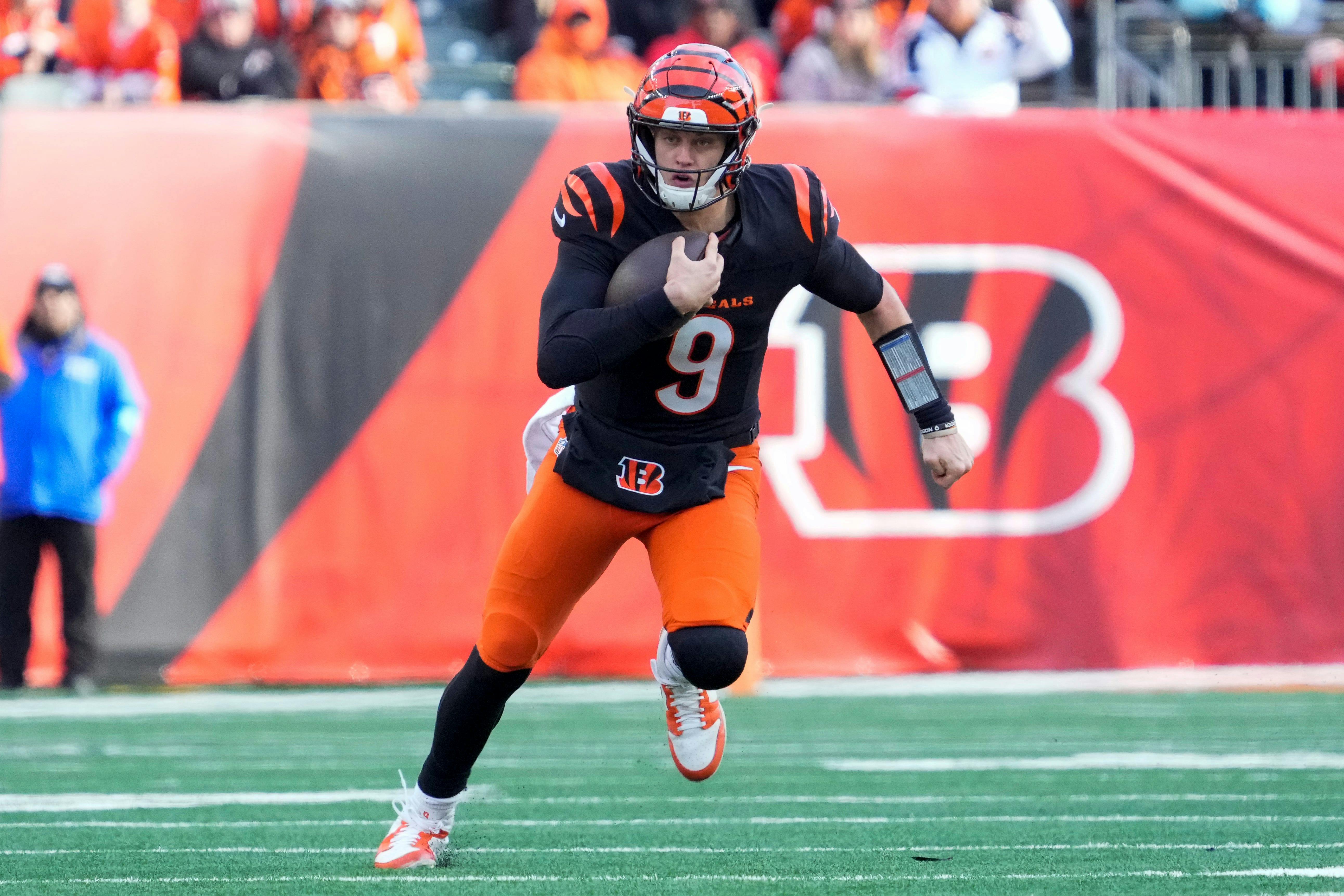 Cincinnati Bengals quarterback Joe Burrow runs for a first down as we look at the best NFL odds Week 18.