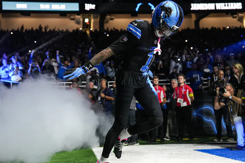 Jameson Williams - who's featured in our anytime TD predictions for Week 9 - runs onto the field.