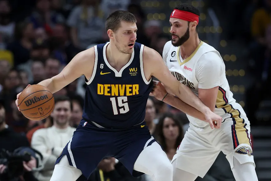 Nikola Jokic of the Denver Nuggets drives as we share our best Pelicans vs. Nuggets player props.