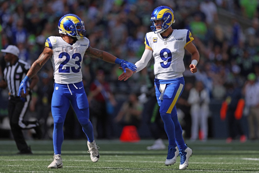 Kyren Williams #23 abd Matthew Stafford #9 of the Los Angeles Rams celebrate as we make our Rams vs. Lions prediction and pick for Sunday Night Football during NFL Wild Card Weekend.