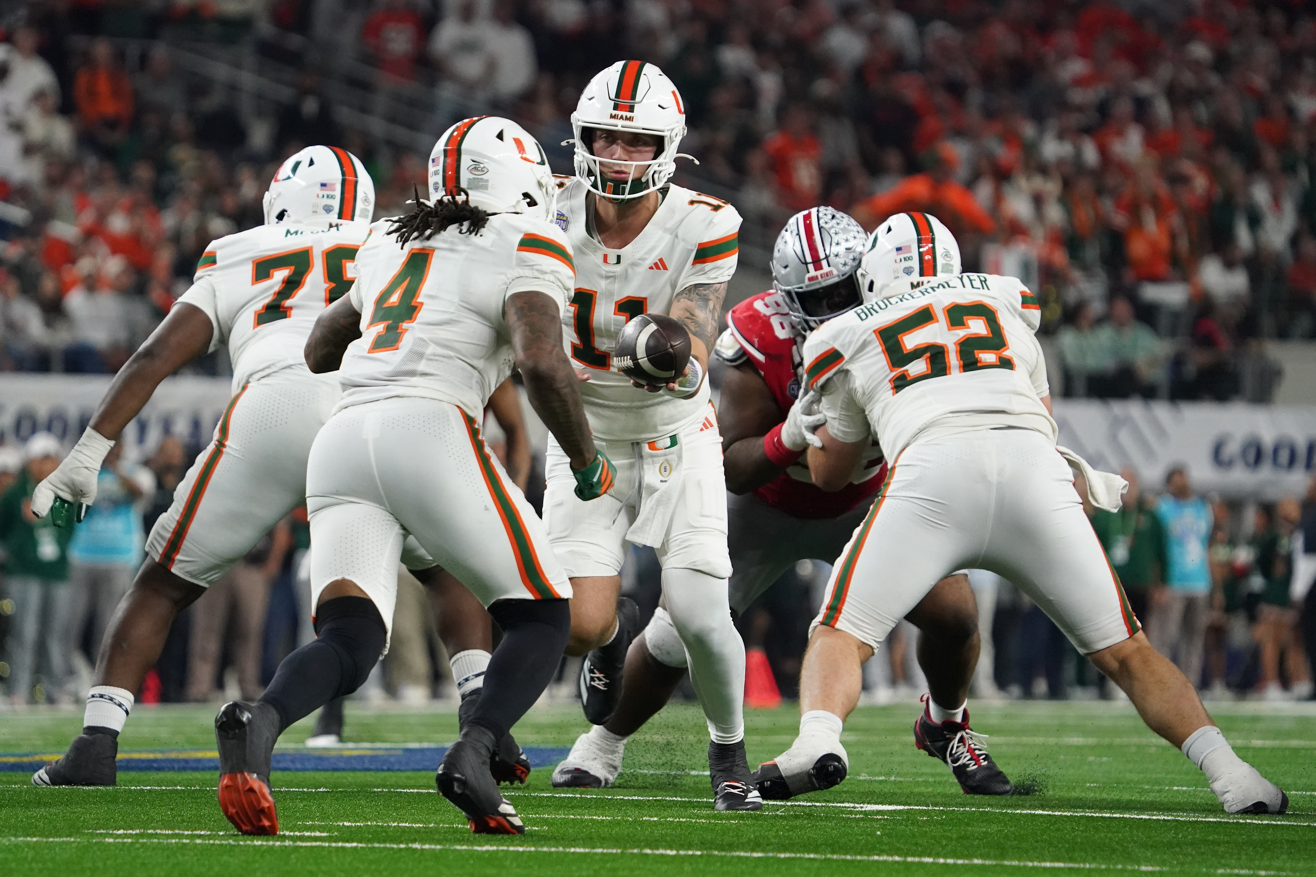 Miami Hurricanes quarterback Carson Beck (11) hands off to running back Mark Fletcher Jr. (4) as we break down our Miami vs. Ole Miss player props for Fiesta Bowl.