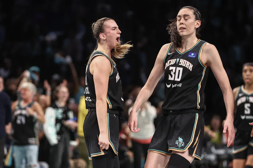 New York Liberty guard Sabrina Ionescu (20) celebrates with forward Breanna Stewart (30) as we offer our Aces vs. Liberty prediction, expert picks, and WNBA playoffs odds for Sunday's Game 2 at Barclays Center.
