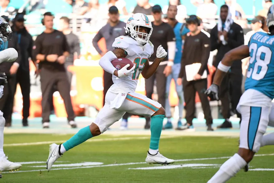 Jaylen Waddle of the Miami Dolphins runs with the ball after a catch during the second quarter against the Carolina Panthers.