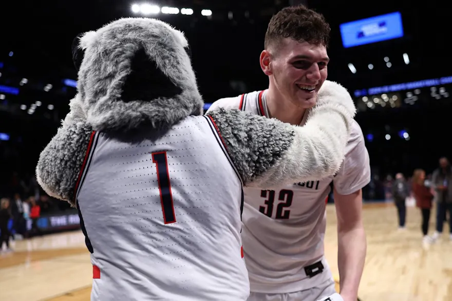 Donovan Clingan of the Connecticut Huskies reacts after a victory against the Northwestern Wildcats, and we offer our top San Diego State vs. UConn player props based on the best March Madness odds.