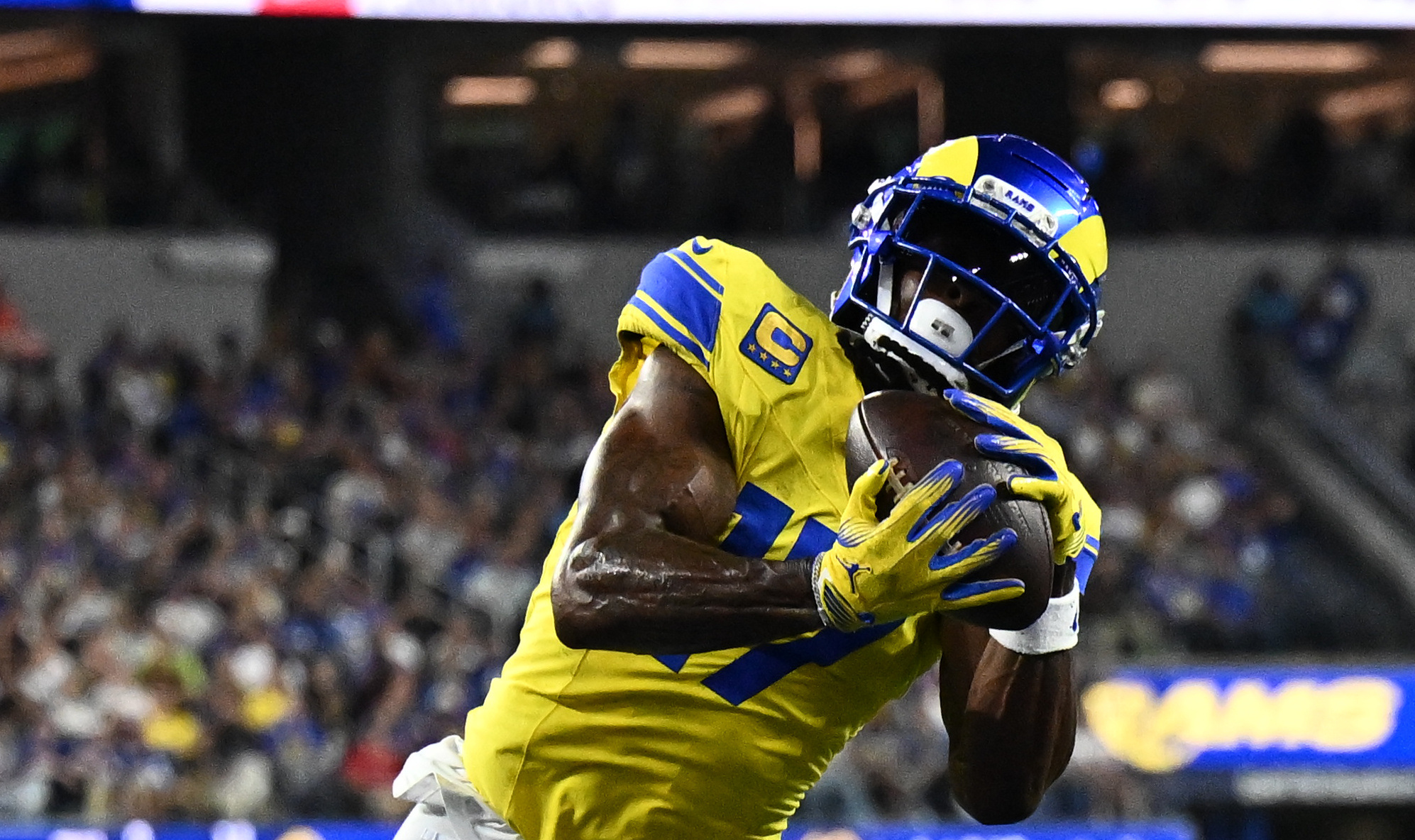 Los Angeles Rams wide receiver Davante Adams (17) scores a touchdown as he is featured in our Rams vs. Broncos touchdown scorer