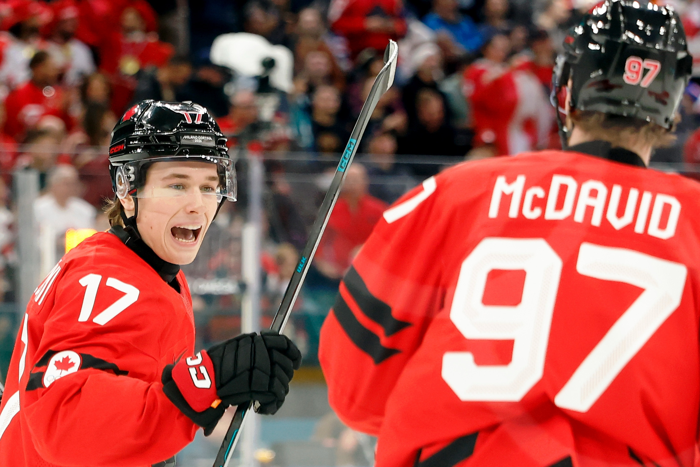 Canada's Macklin Celebrini celebrates a goal with Connor McDavid as we provide our Canada vs. Finland prediction today.