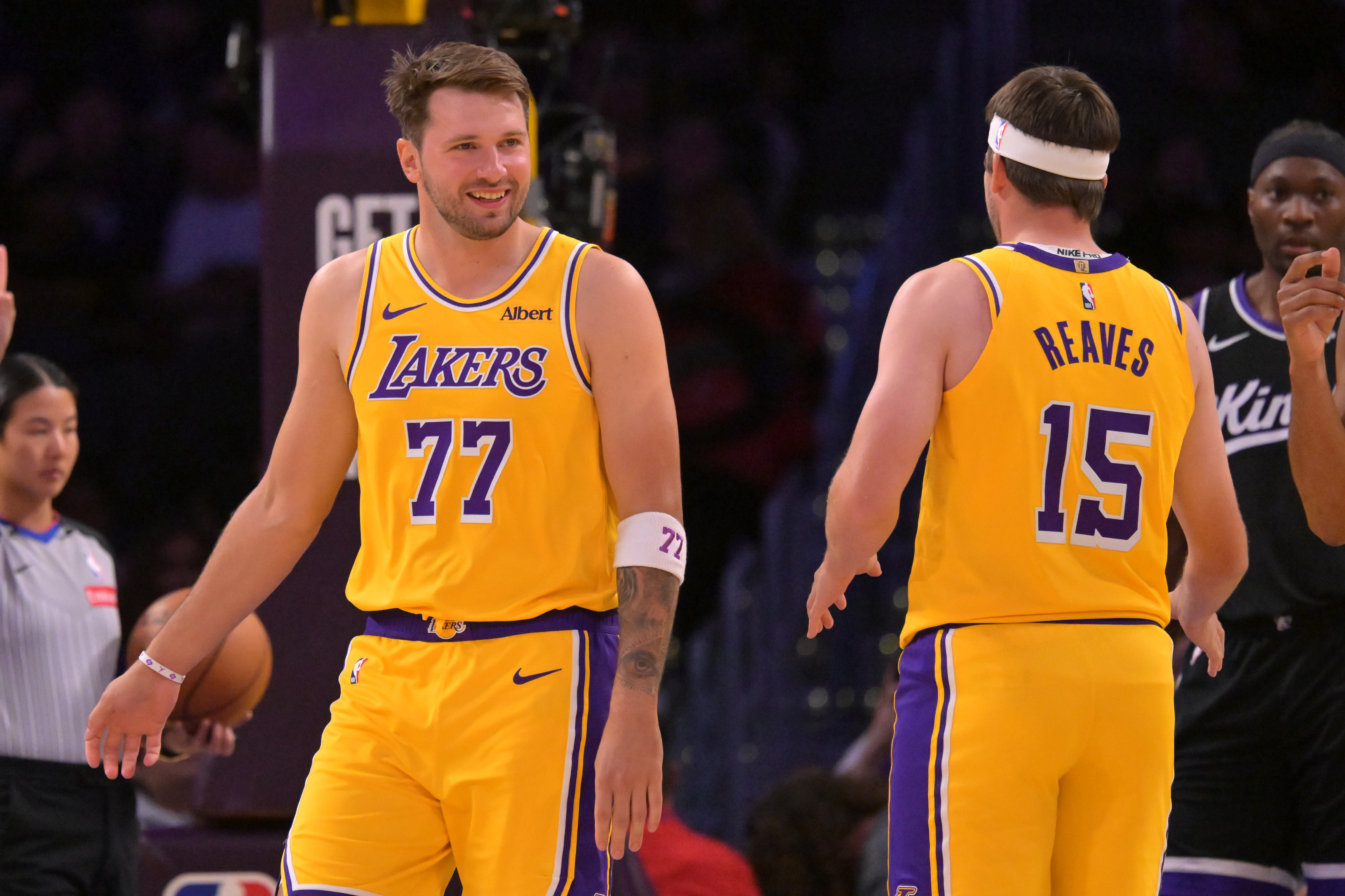 Lakers guards Luka Doncic (77) and Austin Reaves (15) stand on the court as we analyze the 2026-27 NBA championship odds.