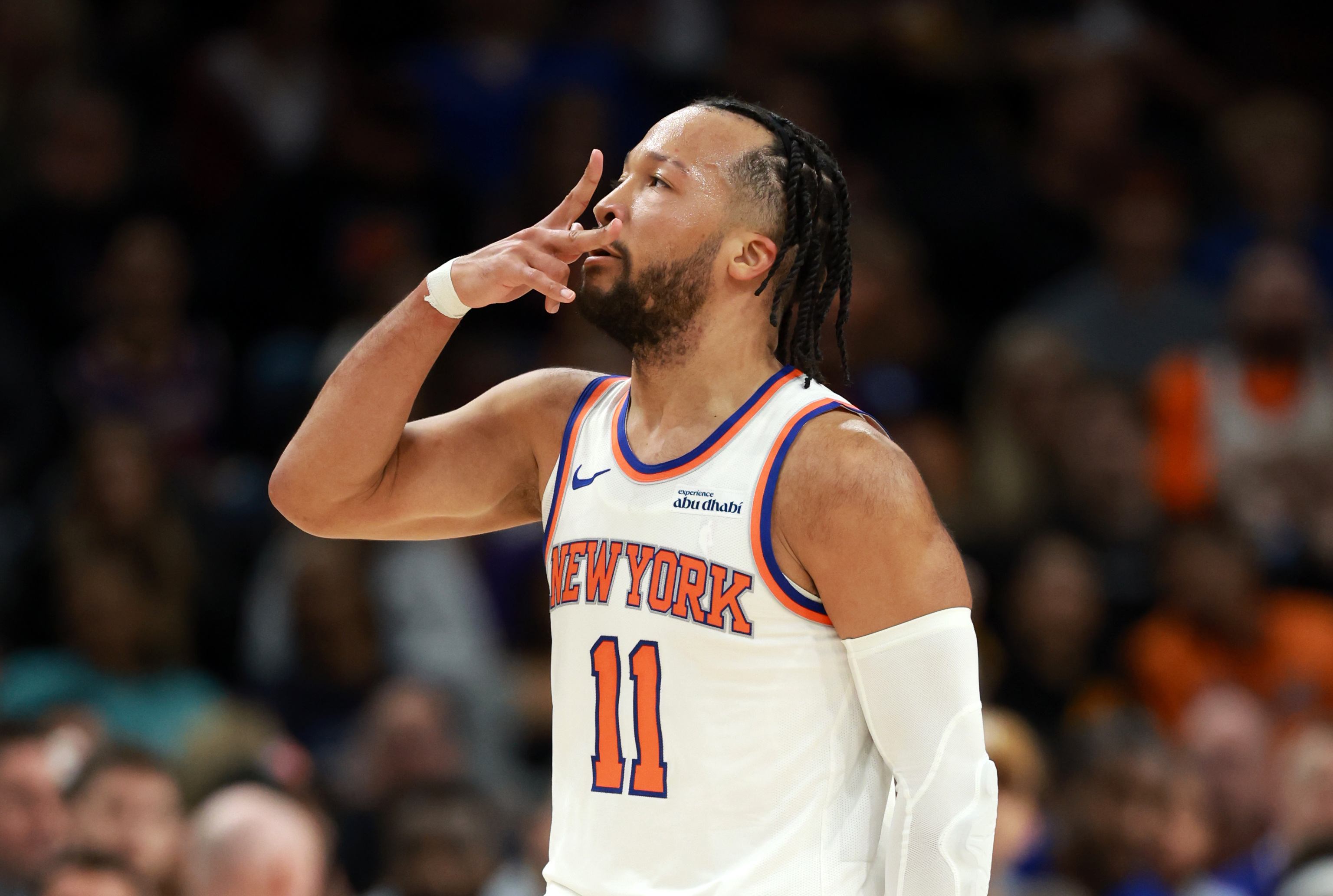 New York Knicks guard Jalen Brunson (11) celebrates a 3-pointer as we break down our Nets vs. Knicks prediction.