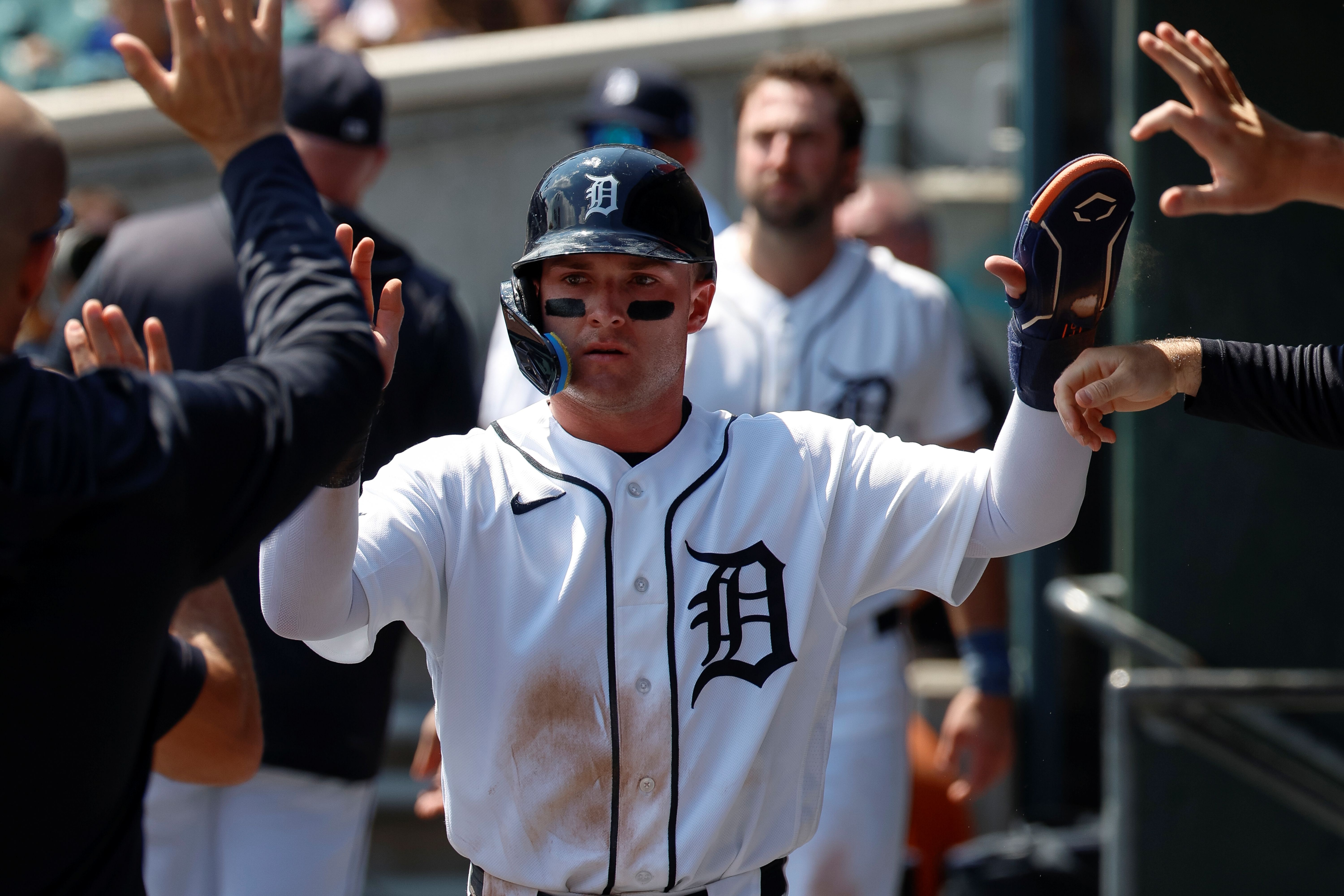 Kevin McGonigle of the Detroit Tigers celebrates with teammates after scoring a run, and he leads the MLB Rookie of the Year Odds on the AL side.