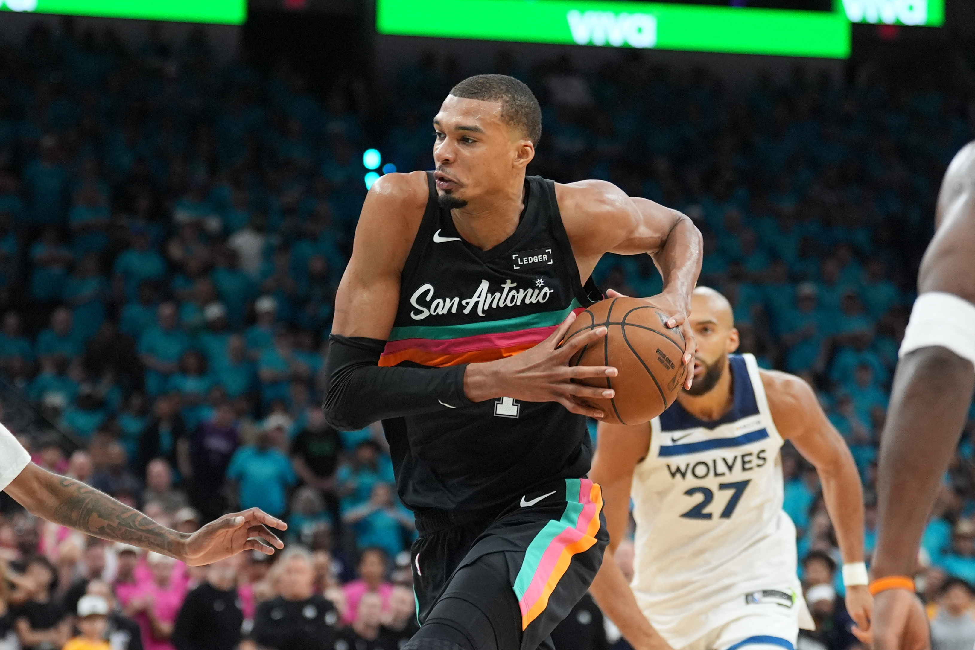San Antonio Spurs forward Victor Wembanyama (1), seen here driving during a game, is featured in our NBA player props today.