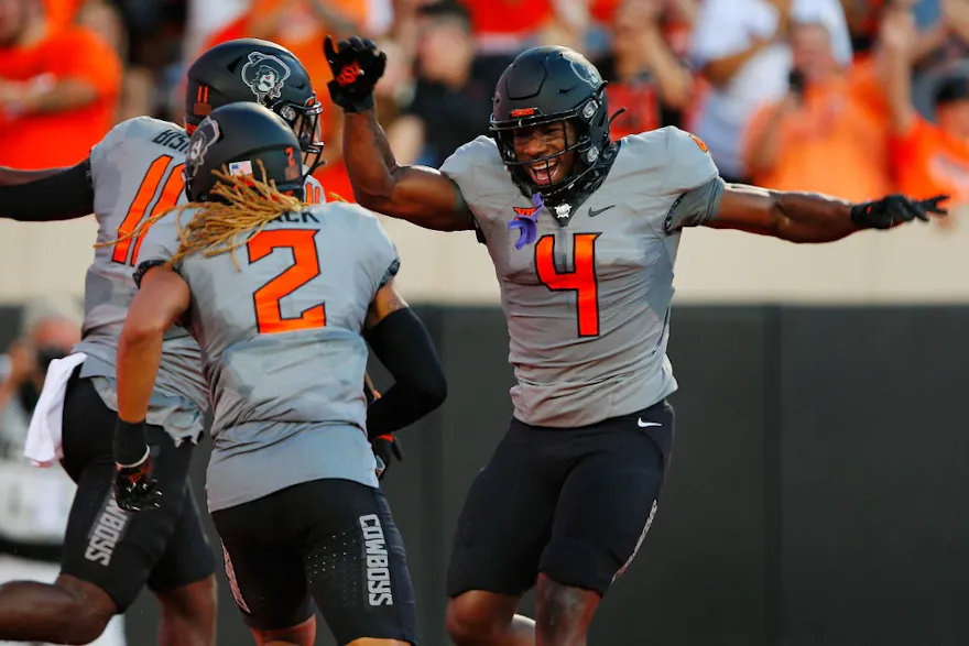 Linebacker Nickolas Martin #4 celebrates a touchdown by teammate Korie Black #2 of the Oklahoma State Cowboys after a blocked field goal attempt against the Arkansas Pine Bluff Golden Lions in the second quarter at Boone Pickens Stadium.
