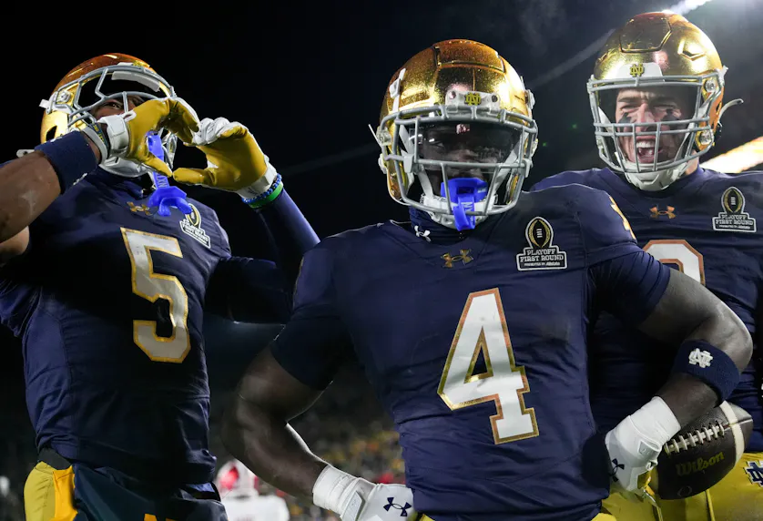 Notre Dame Fighting Irish running back Jeremiyah Love celebrates after scoring a touchdown as we make our Ohio State vs. Notre Dame touchdown scorer predictions ahead of the CFP National Championship.