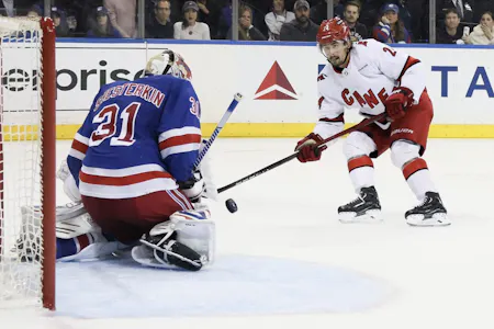 Igor Shesterkin (31) of the New York Rangers blocks a shot from Seth Jarvis (24) of the Carolina Hurricanes, as we offer our Rangers vs. Hurricanes expert picks and predictions for Saturday's Game 4 at PNC Arena in Raleigh, N.C.