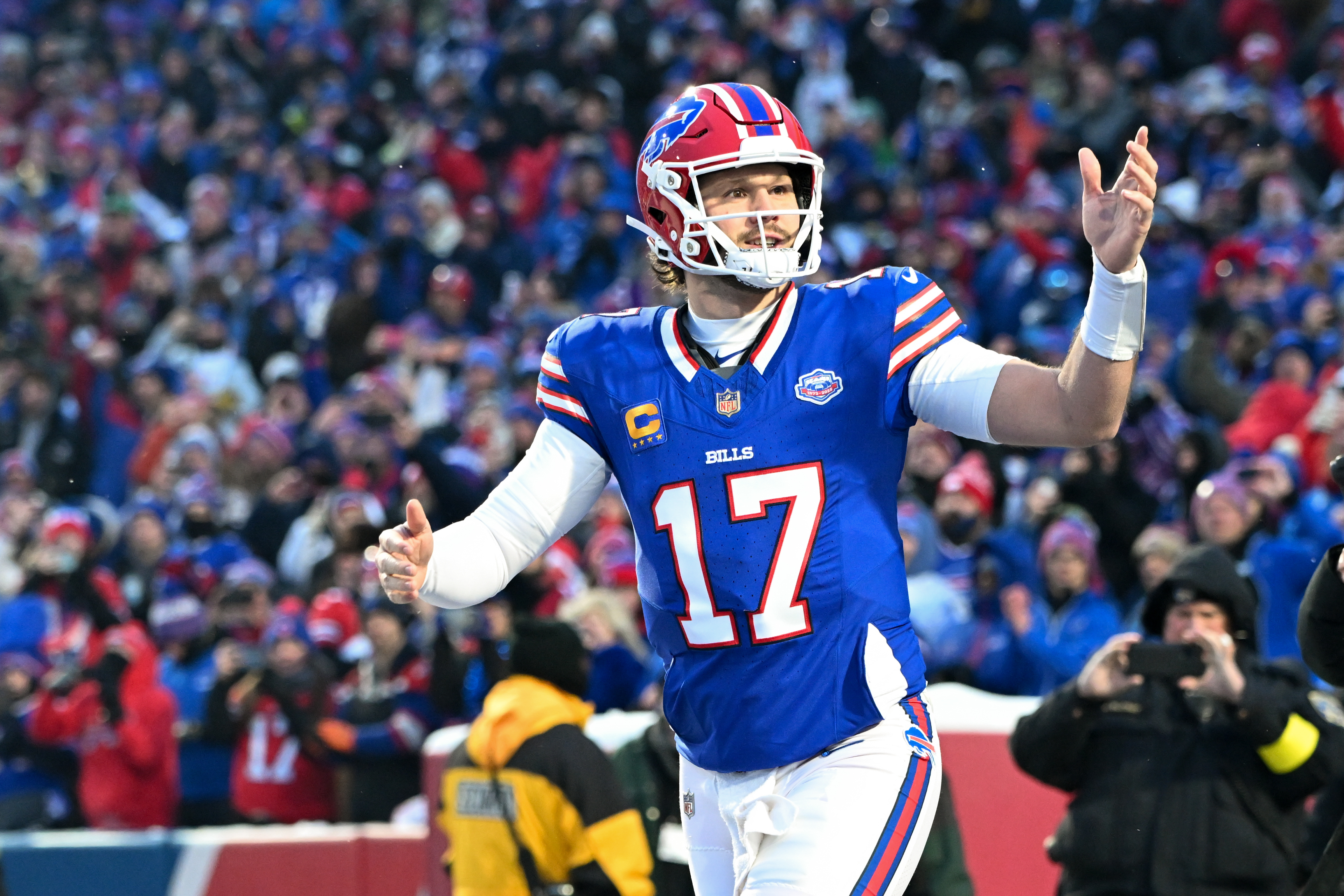 Buffalo Bills quarterback Josh Allen - who's featured in my Bills vs. Jaguars player props - runs onto the field.
