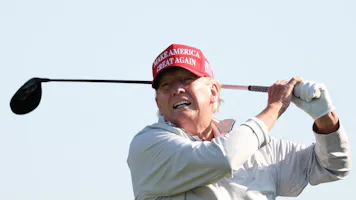 Former President Donald Trump follows his tee shot during the pro-am prior to the LIV Golf Invitational - DC at Trump National Golf Club as we look at our Donald Trump presidential odds for 2024.