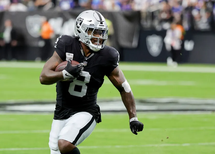 Running back Josh Jacobs #8 of the Las Vegas Raiders runs against the New York Giants as we give our Raiders vs. Dolphins Week 11 NFL player prop predictions