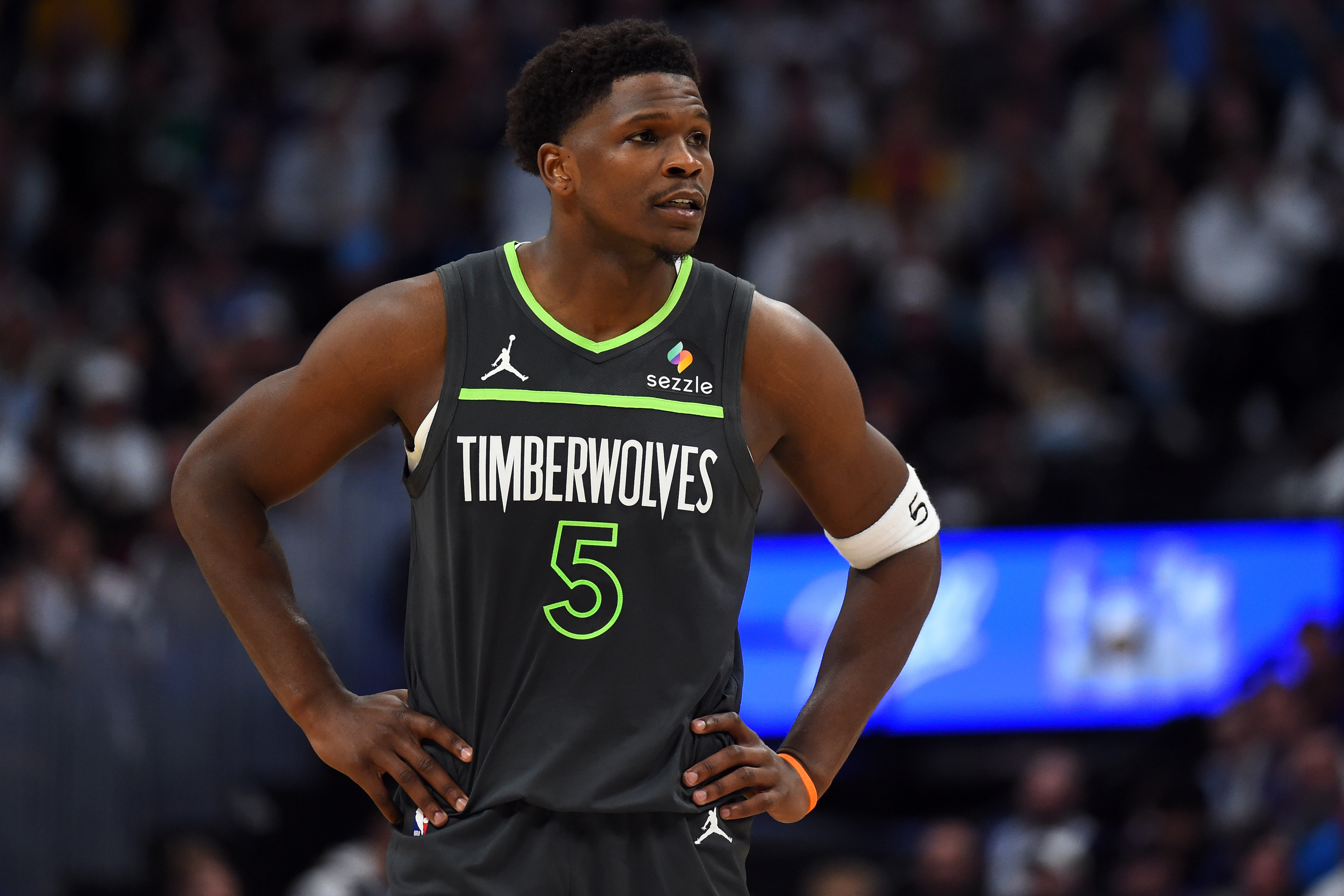 Minnesota Timberwolves guard Anthony Edwards (5), seen here looking on during a game, is featured in our NBA player props today.