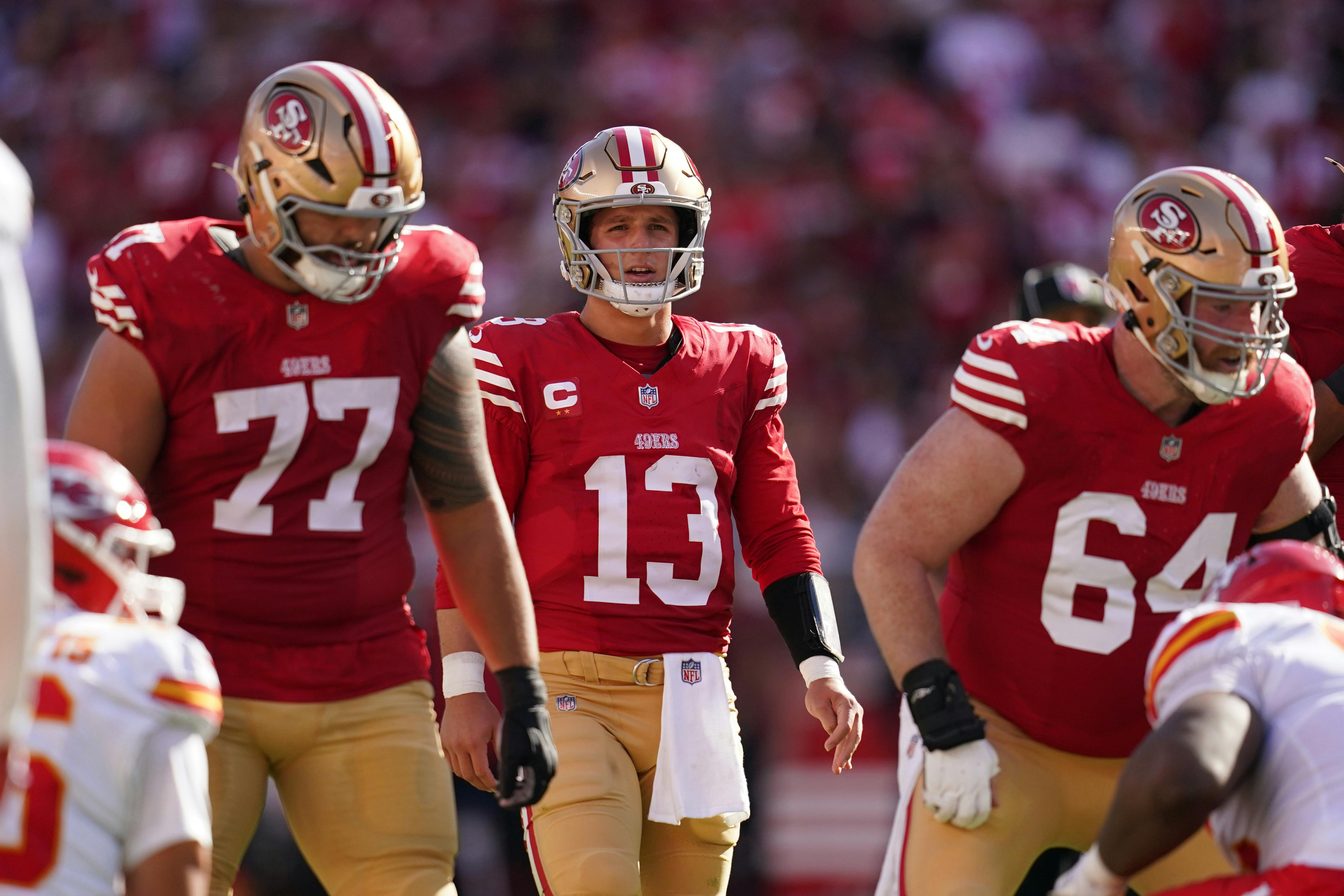 San Francisco 49ers quarterback Brock Purdy walks toward the line of scrimmage as we break down the latest 2025 Super Bowl odds after NFL Week 12.