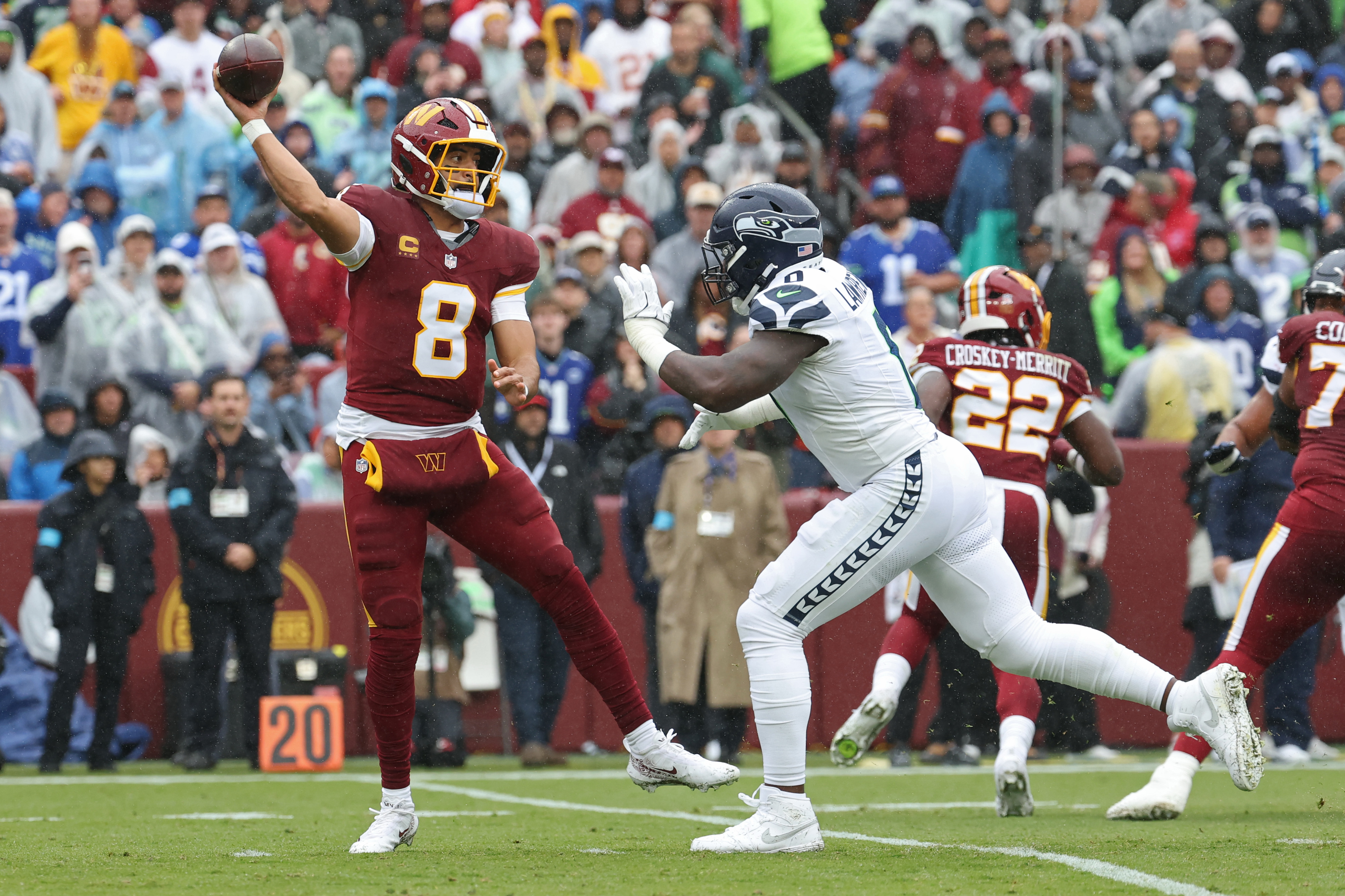 Pictured: Quarterback Marcus Mariota throwing a pass as we break down our Colts vs. Commanders Prediction. Photo by Geoff Burke-Imagn Images.