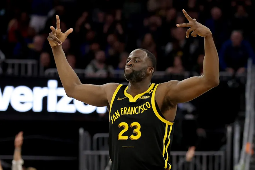 Draymond Green #23 of the Golden State Warriors reacts after making a three-point basket as we look at our NBA player props and best bets for Saturday
