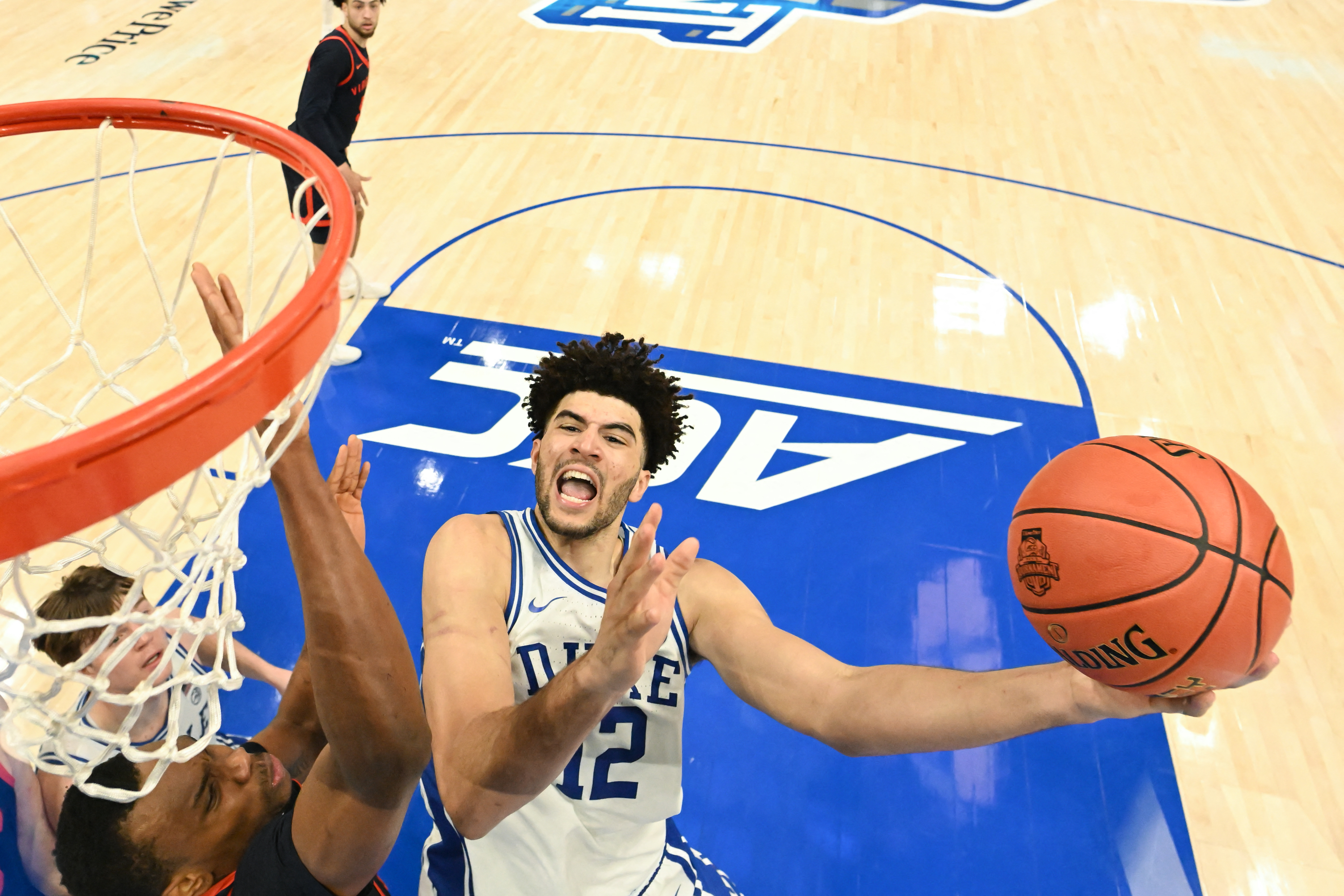 Duke Blue Devils forward Cameron Boozer goes to the basket as we make our best March Madness Most Outstanding Player (MVP) predictions