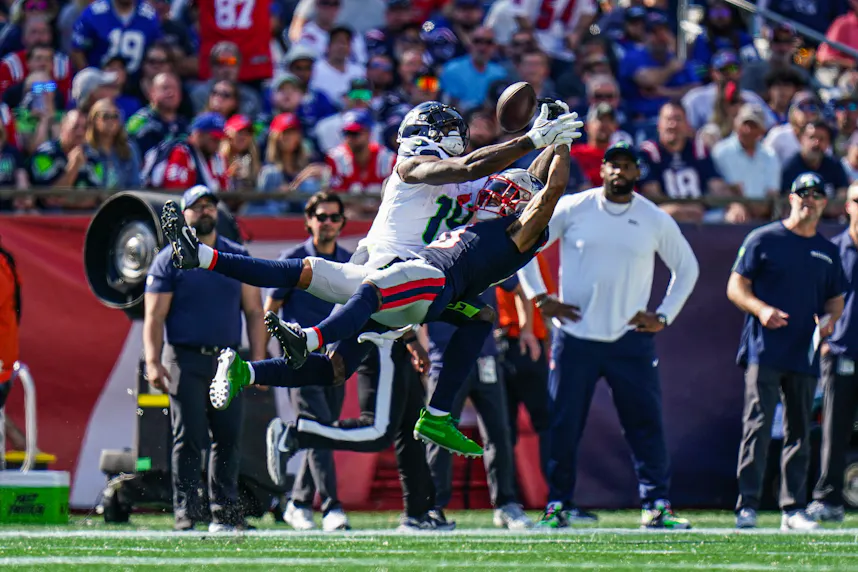 New England Patriots cornerback Christian Gonzalez defends against Seattle Seahawks wide receiver DK Metcalf as we offer our Seahawks vs. Lions prop bets.