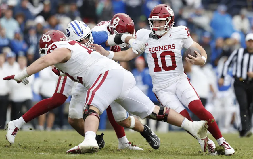 Jackson Arnold #10 of the Oklahoma Sooners folows blocker McKae Mettauer #72 during the second half as we make our Arizona vs. Oklahoma prediction and pick for the 2023 Alamo Bowl on Thursday.