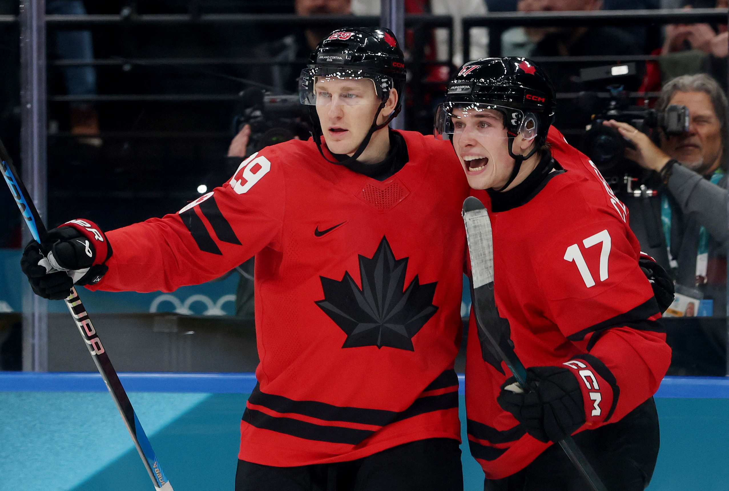 Nathan MacKinnon and Macklin Celebrini celebrate a goal as we provide our Canada vs. France prediction and best bets.