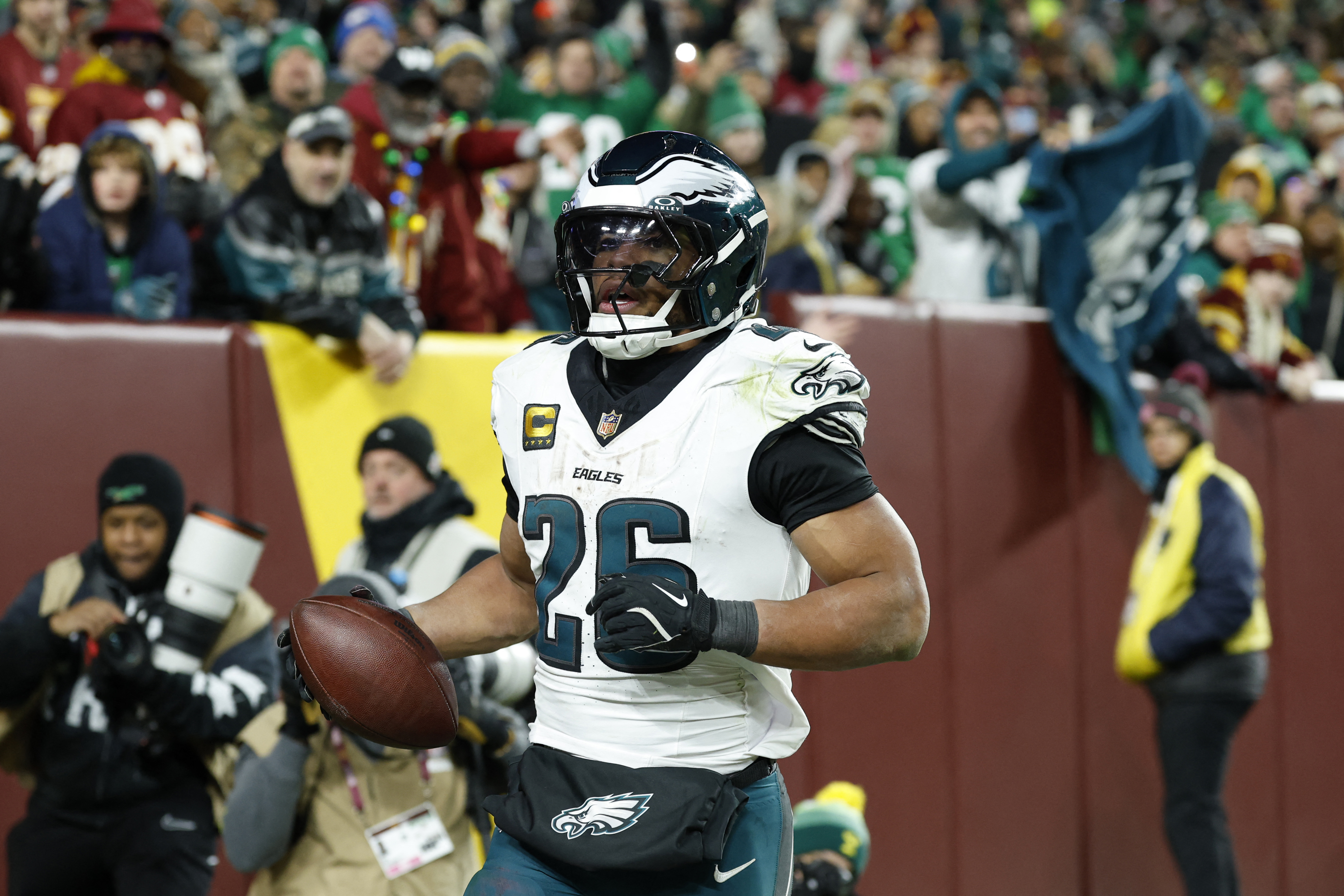 Philadelphia Eagles running back Saquon Barkley (26) celebrates after scoring a touchdown as he is featured in our NFL anytime touchdown scorer predictions.