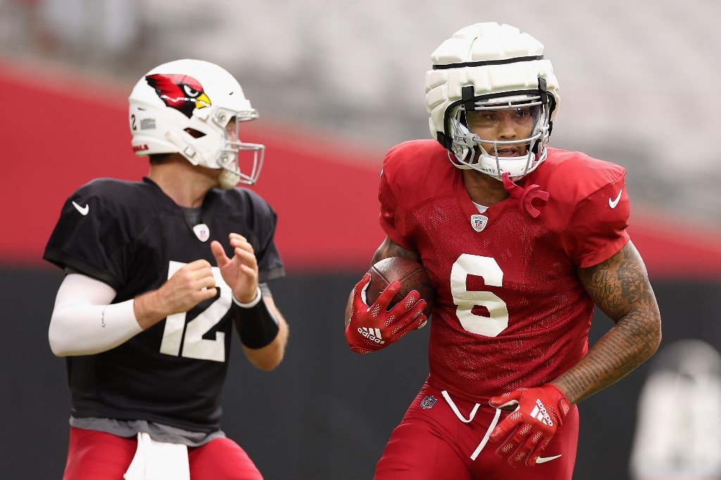 Running back James Conner of the Arizona Cardinals participates in a team practice ahead of the NFL season at State Farm Stadium as we look at the June Arizona sports betting report.