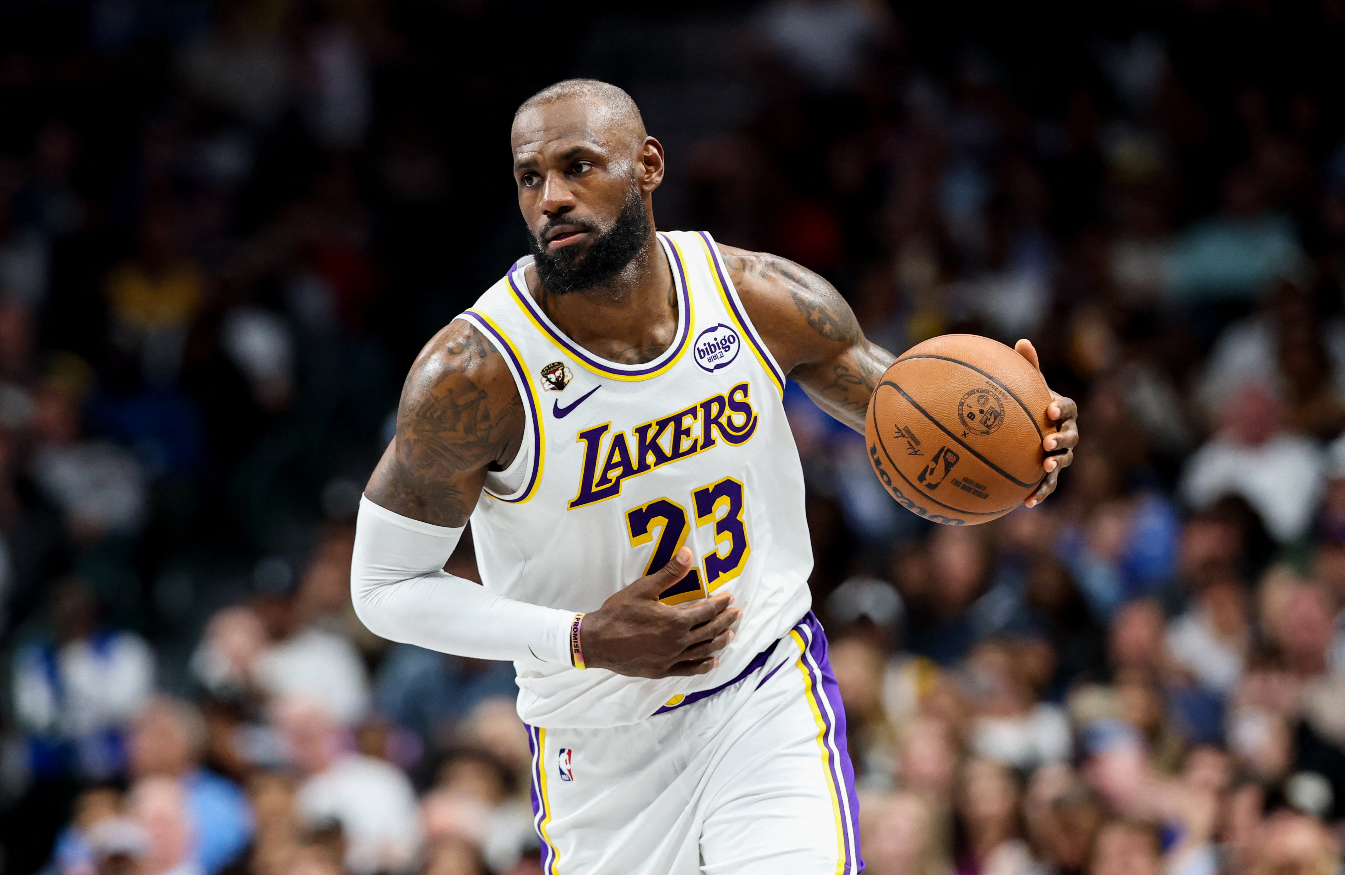 Los Angeles Lakers forward LeBron James (23) controls the ball as he is featured in our Rockets vs. Lakers player props today.