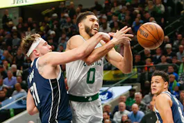 Boston Celtics forward Jayson Tatum (0) is fouled by Dallas Mavericks guard Luka Doncic (77) as we offer our best 2024 NBA Finals series props and expert predictions for Mavericks vs. Celtics stat leaders ahead of Thursday's Game 1 at TD Garden in Boston.