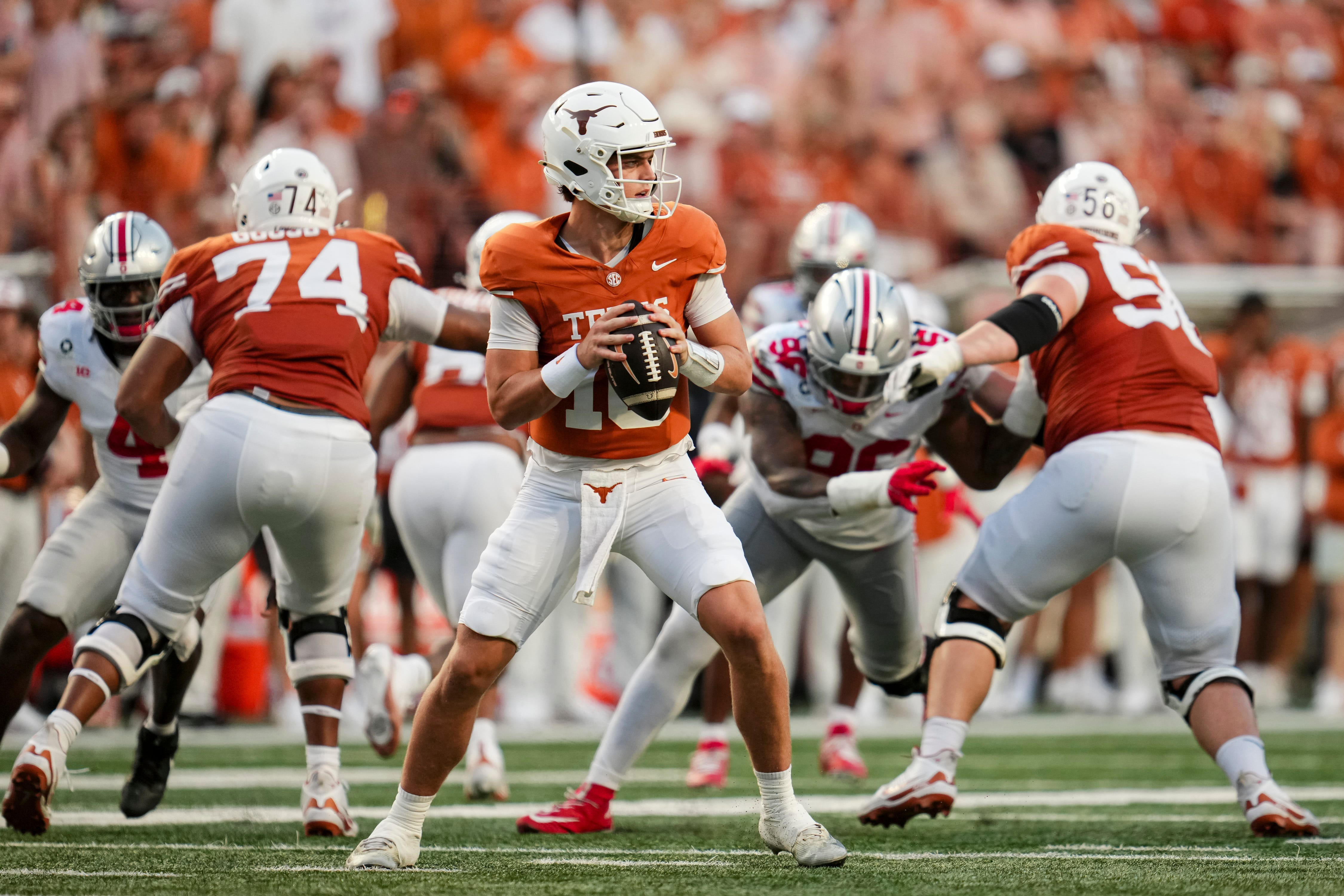 Pictured: Longhorns quarterback Arch Manning in the pocket as we break down our Texas vs. Oklahoma Prediction. Photo by USA TODAY Network via Reuters Connect.