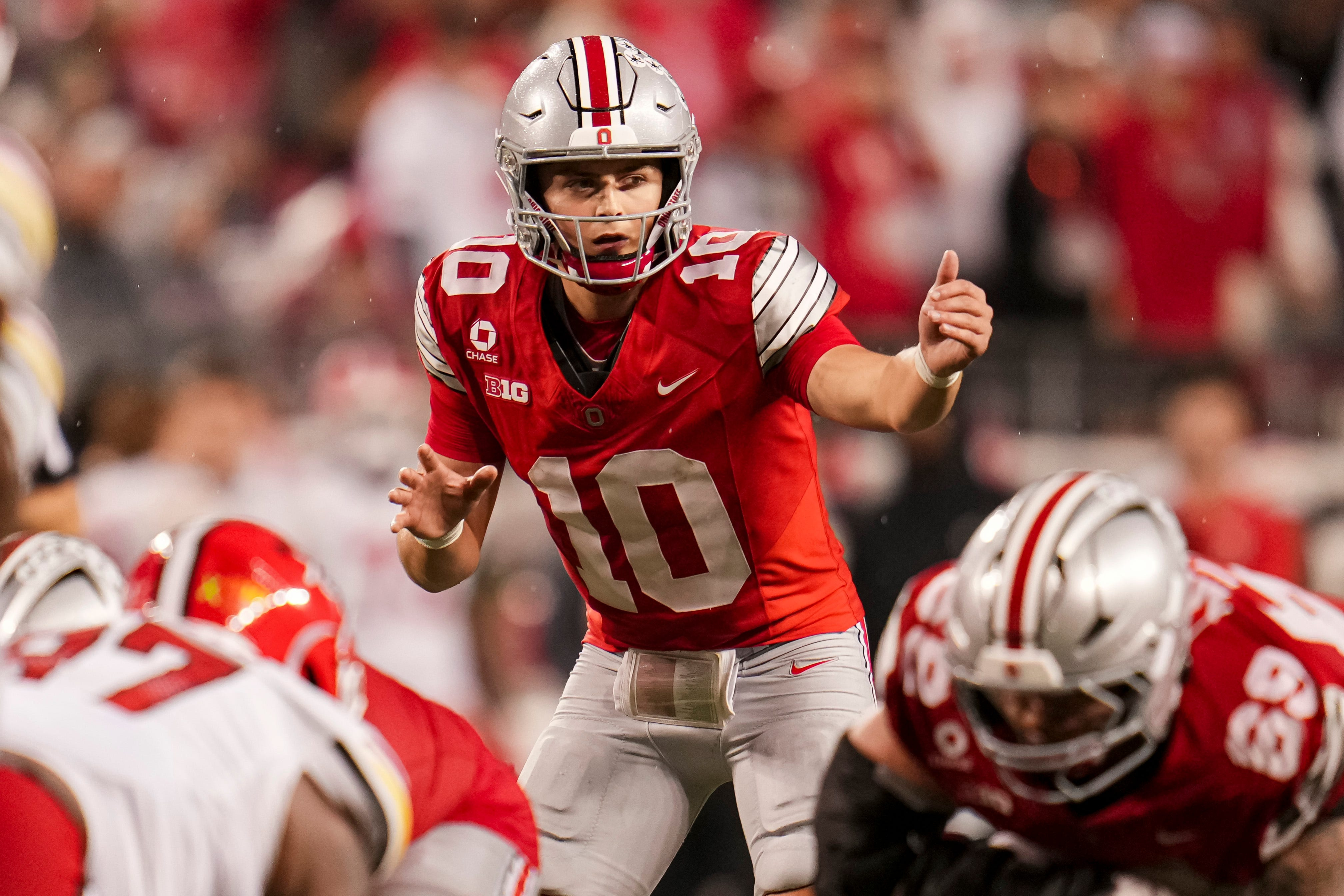 Ohio State Buckeyes quarterback Julian Sayin (10) motions as he is featured in our Ohio State vs. Indiana expert picks.