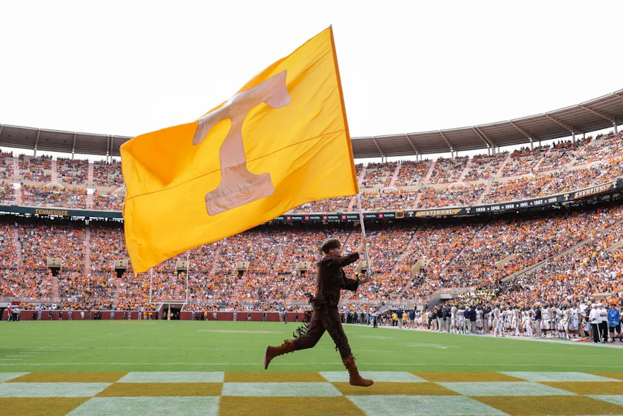 Tennessee mascot Davy Crockett carries the flag across the end zone during a game between the Tennessee Volunteers and the East Tennessee State University Buccaneers as we look at the July numbers for Tennessee.