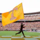 Tennessee mascot Davy Crockett carries the flag across the end zone during a game between the Tennessee Volunteers and the East Tennessee State University Buccaneers as we look at the July numbers for Tennessee.