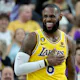 LeBron James of the Los Angeles Lakers laughs during a game against the Phoenix Suns, and we offer new U.S. bettors our exclusive bet365 bonus code.