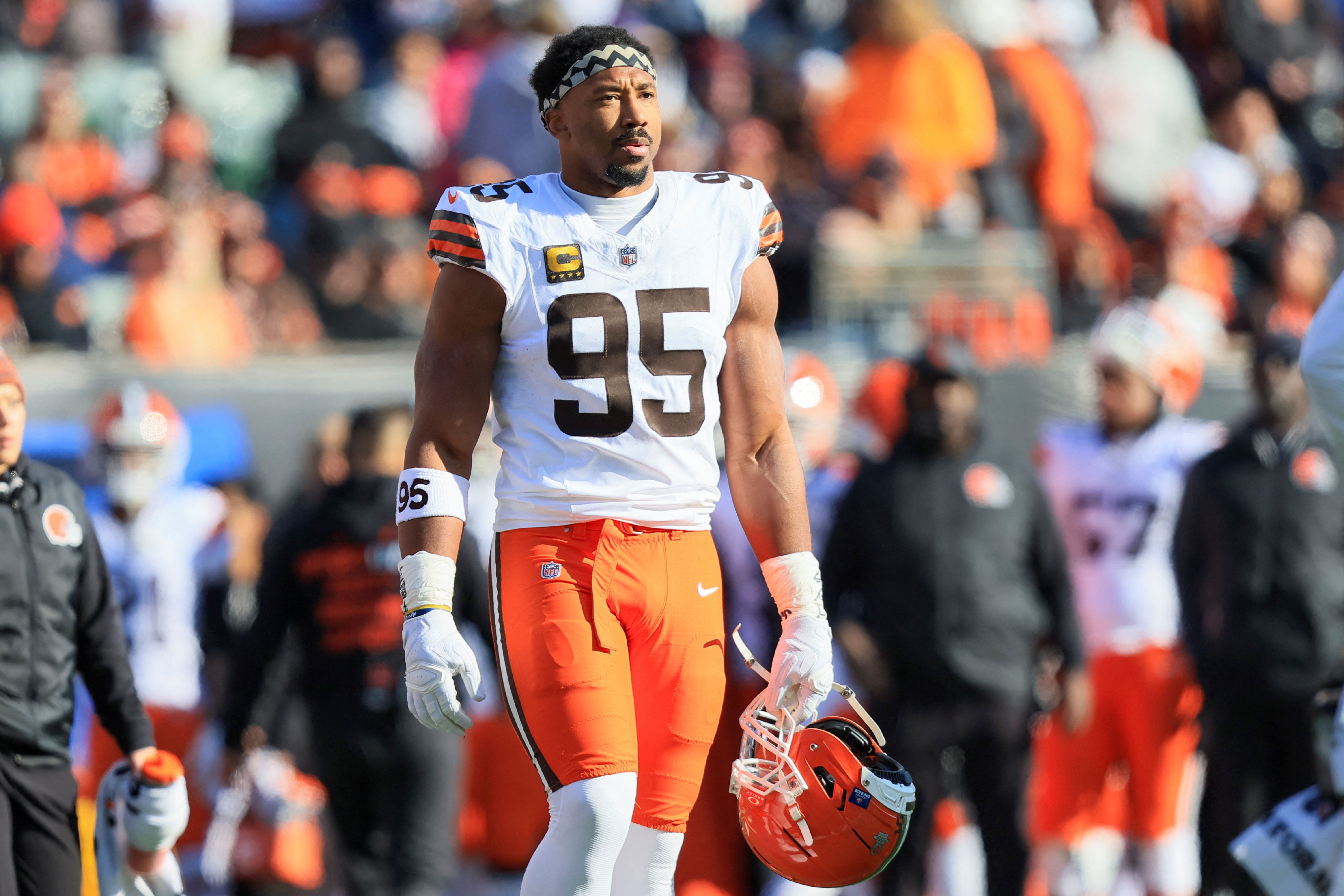 Cleveland Browns defensive end Myles Garrett walks on the field, and he's key as we look at our defensive player of the year odds