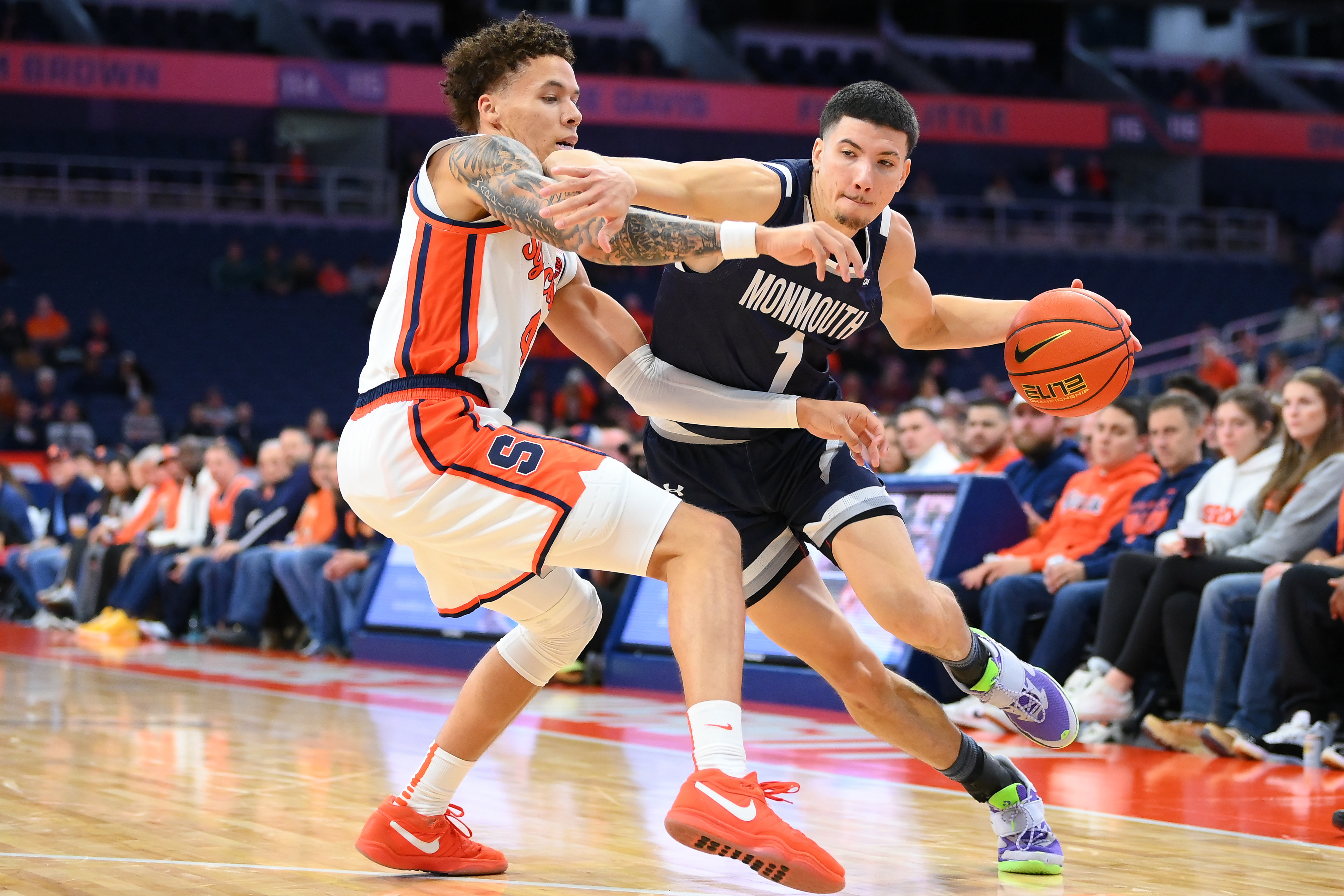 Monmouth Hawks forward Jason Rivera-Torres (1), seen here driving, is featured in our Monmouth vs. Hofstra prediction tonight.