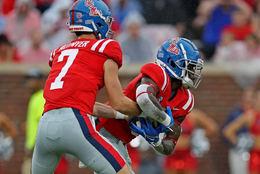 Luke Altmyer of the Ole Miss Rebels hands Zach Evans the ball against the Central Arkansas Bears at Vaught-Hemingway Stadium in Oxford, Mississippi.  Photo by Justin Ford/Getty Images via AFP.