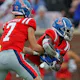 Luke Altmyer of the Ole Miss Rebels hands Zach Evans the ball against the Central Arkansas Bears at Vaught-Hemingway Stadium in Oxford, Mississippi.  Photo by Justin Ford/Getty Images via AFP.