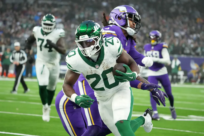 New York Jets running back Breece Hall carries the ball as we offer our Bills vs. Jets prediction for MNF.