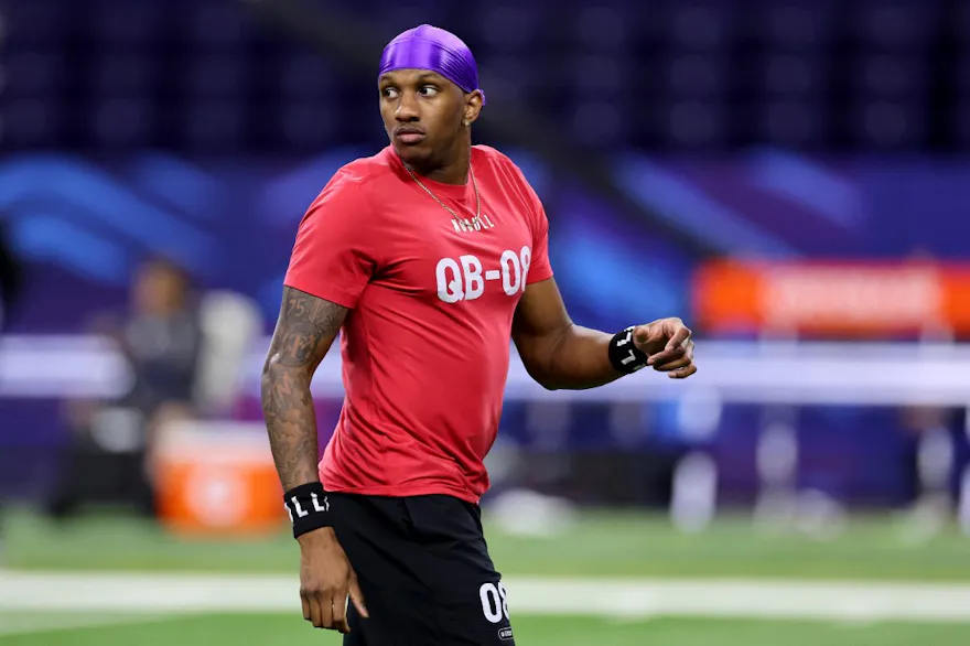 Michael Penix #QB08 of Washington looks on during the NFL Combine as we look at the details surrounding some major payouts on his selection in the NFL draft.