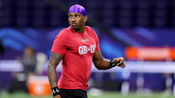 Michael Penix #QB08 of Washington looks on during the NFL Combine as we look at the details surrounding some major payouts on his selection in the NFL draft.