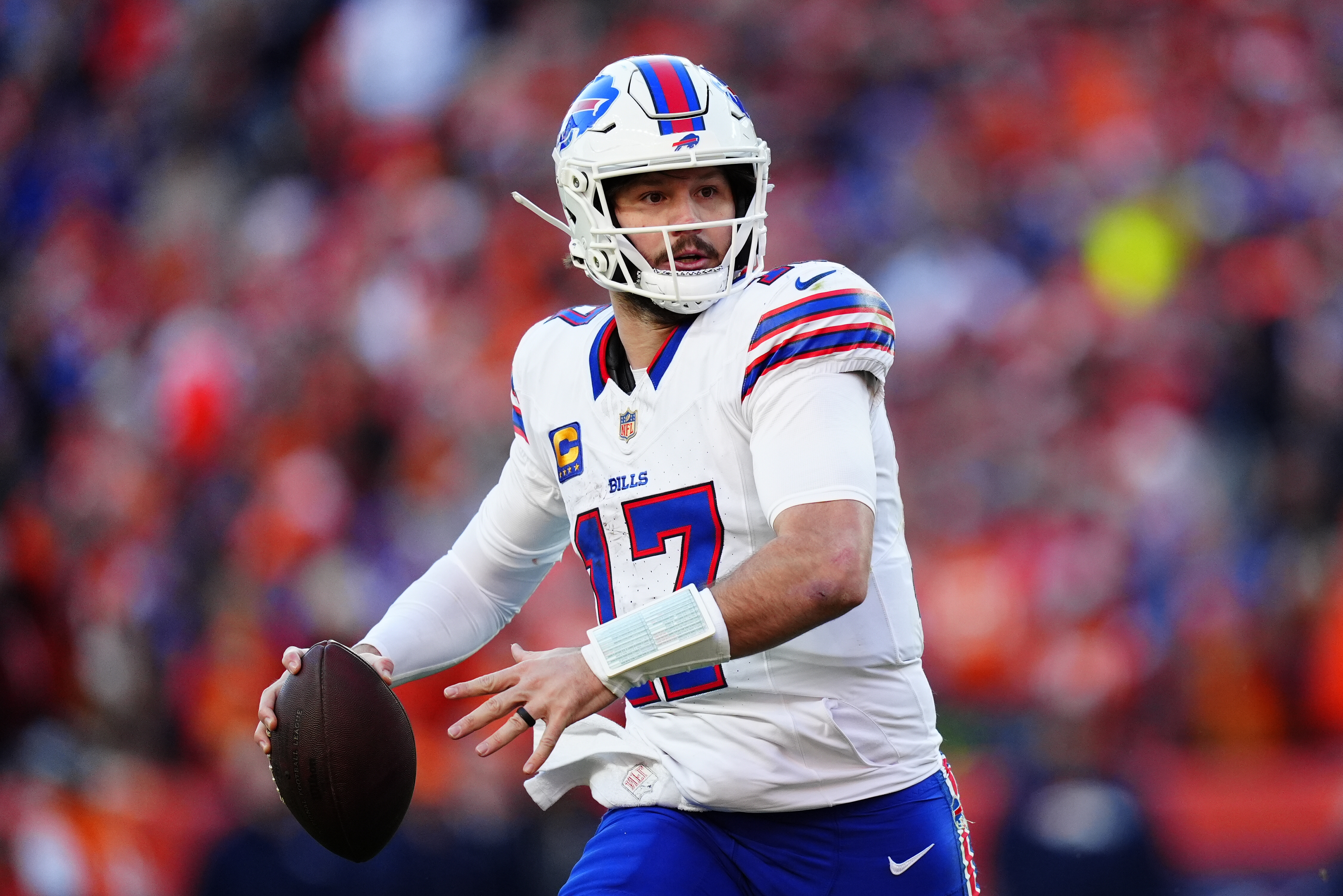 Bills quarterback Josh Allen (17) rolls out as we break down our Lions vs. Bills prediction.