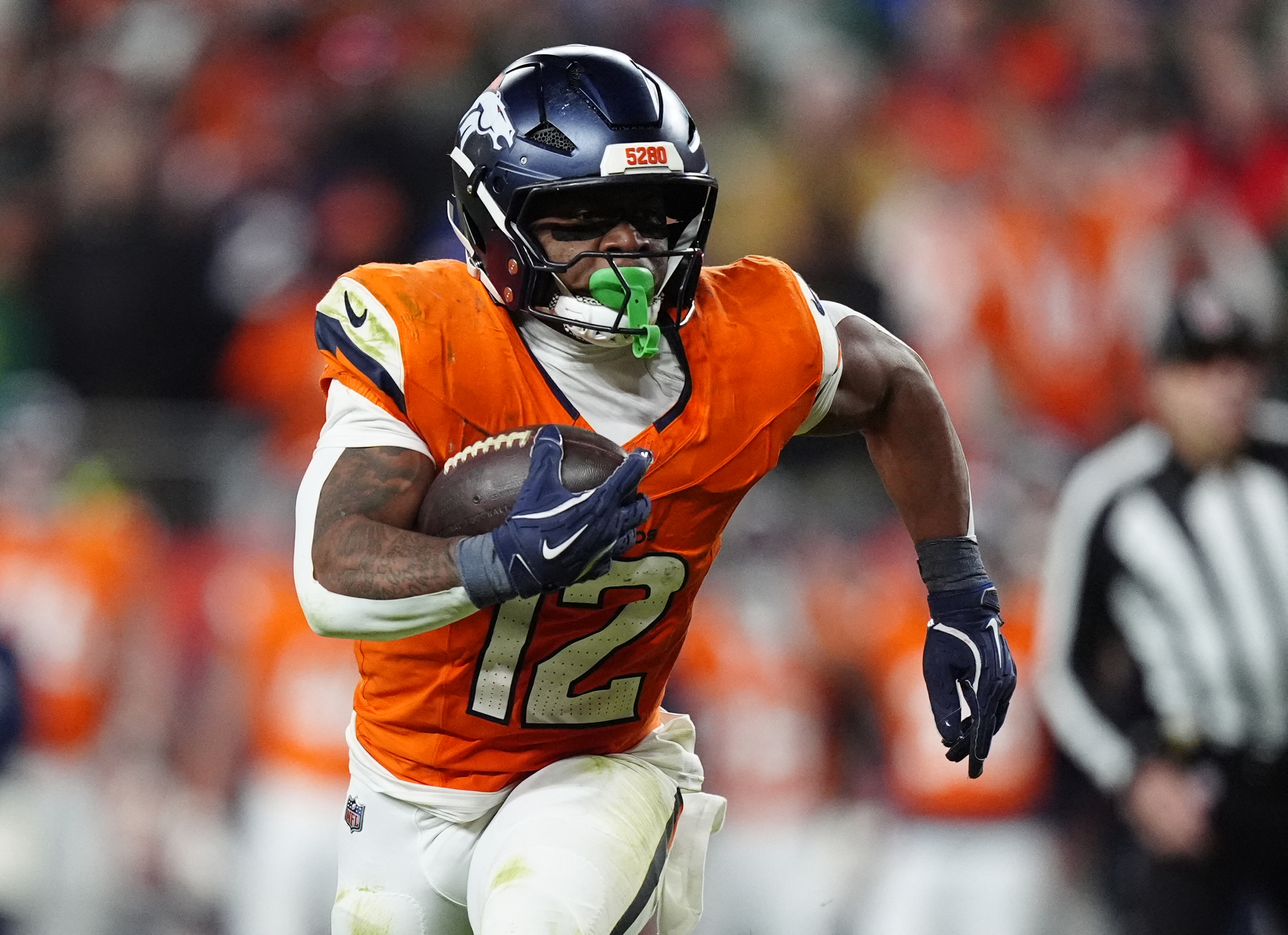 Denver Broncos running back RJ Harvey runs for a gain as we look at the AFC Championship odds.