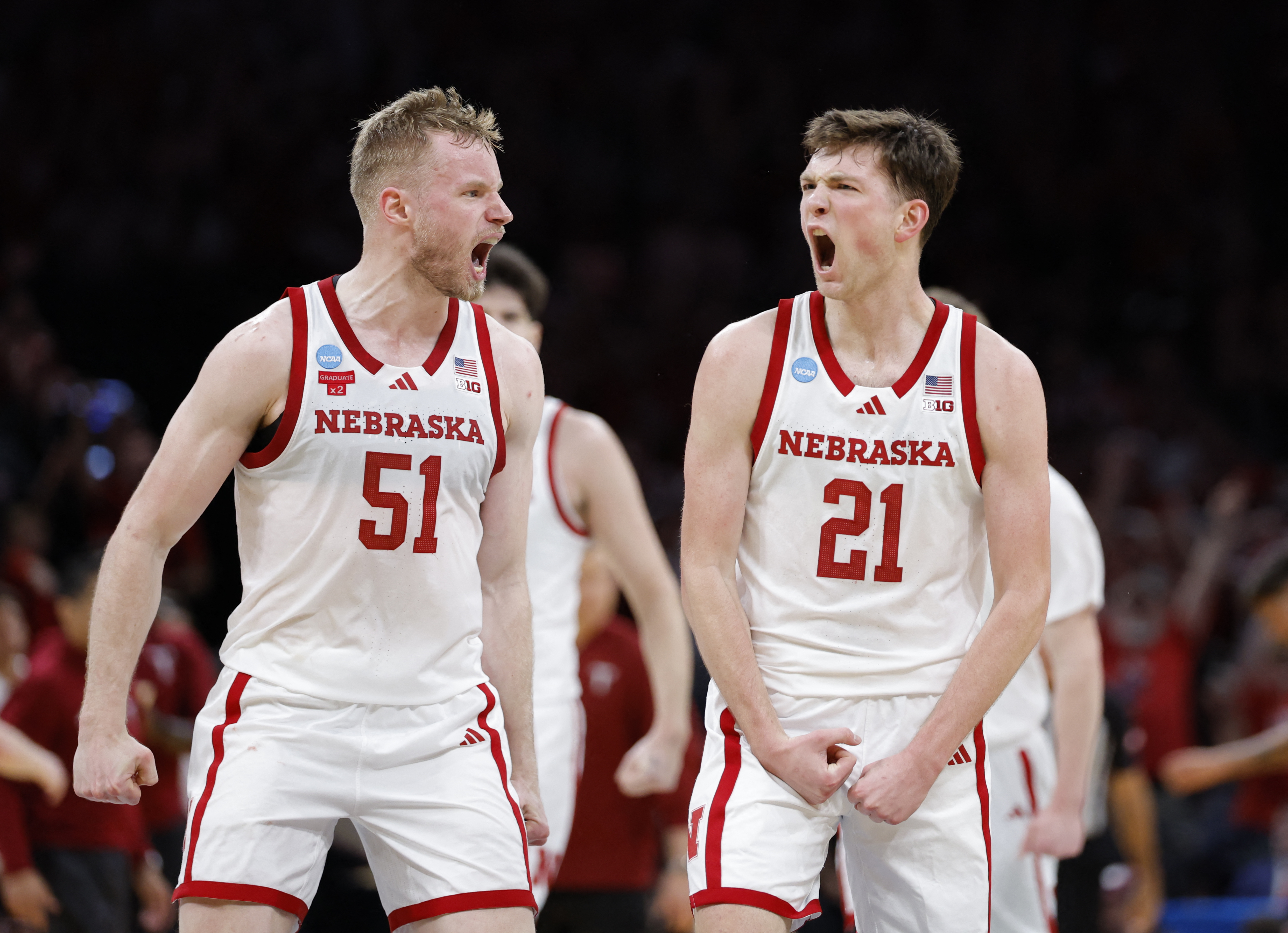 Nebraska Cornhuskers forward Rienk Mast (51) and forward Pryce Sandfort (21), featured in our Iowa vs. Nebraska player props, react during a game.