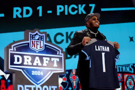 C Latham celebrates after being selected seventh overall by the Tennessee Titans as we look at the 2024 April sports betting financials